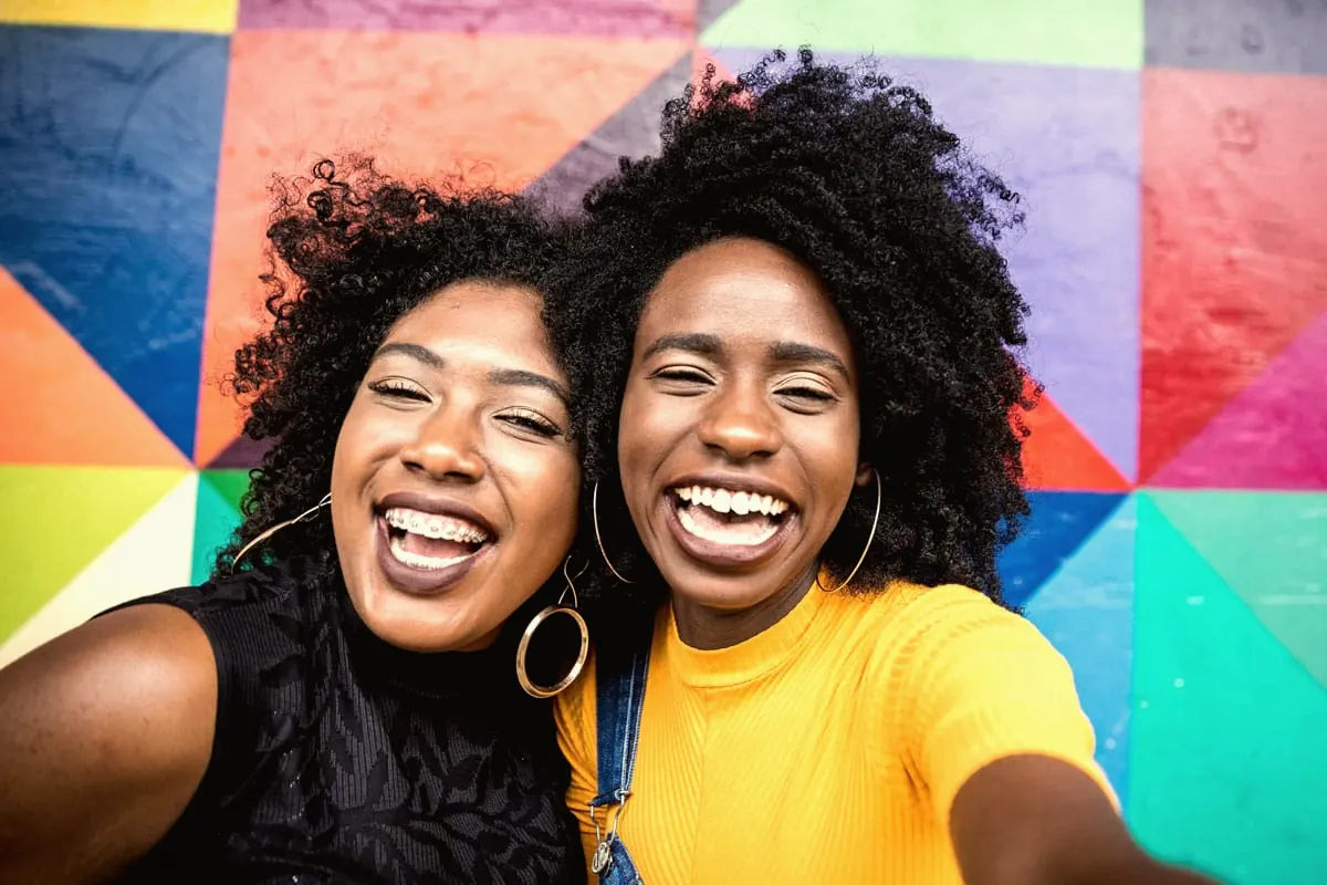 Two friends smiling together